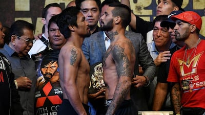 Manny Pacquiao and Lucas Matthysse stare each other down. Reuters