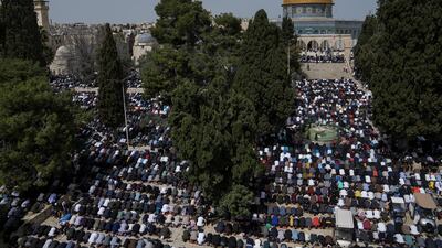 Muslims offer prayer on the first Friday of Ramadan outside the Dome of Rock Mosque at Al Aqsa compound in Jerusalem's Old City. AP