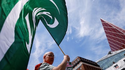 An RMT member pickets outside Victoria station in London. Reuters