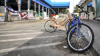Bicycles are parked at the Vegetables and Fruit Market.