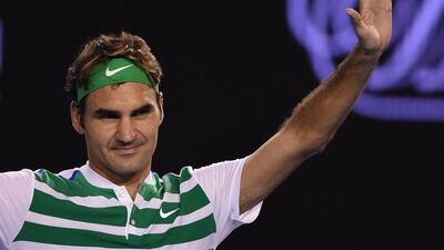 Roger Federer waves to the crowd after beating Grigor Dimitrov on Friday in his Australian Open third round match. Greg Wood / AFP / January 22, 2016