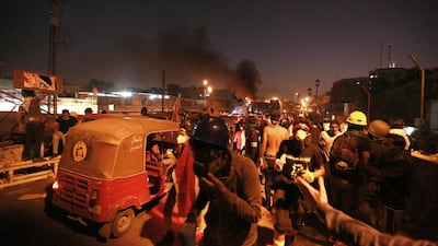 Iraqi security forces fired live ammunition and tear gas while anti-government protests gather near the state-run TV in Baghdad, Iraq. AP Photo