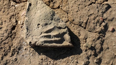 A clay tablet bearing fingerprints
