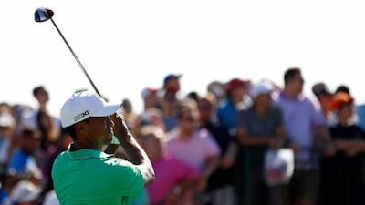 Tiger Woods is tied for fourth, four shots behind co-leaders Matt Kuchar and Gary Woodland.