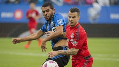 Montreal Impact's Victor Cabrera, left, challenges Toronto FC's Sebastian Giovinco during first half MLS match in Montreal, Sunday, October 16, 2016. Graham Hughes / AP Photo