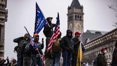 Supporters of President Trump gather in Freedom Plaza on Tuesday evening, ahead of all-day demonstrations on Wednesday, the day Congress is meeting to certify the 2020 election results. Mr Trump is slated to speak at a rally Wednesday. AFP
