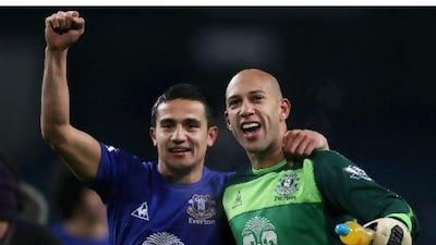 Tim Cahill, left, and Tim Howard celebrate Everton's win at Manchester City.