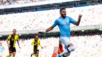 Watford goalkeeper Ben Foster (bottom) fouls Manchester City's Riyad Mahrez in the penalty box. EPA