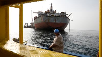A UN staff looks at FSO Safer oil tanker moored in the Red Sea, off the coast of the western Hodeidah province, Yemen, 15 July 2023. The transfer of 1. 14 million barrels of oil from the 47-year-old FSO Safer supertanker, stranded off Yemen's Red Sea coast since 1988, will begin next week after the UN-purchased vessel sailed from Djibouti en route to the Safer site, the United Nations has reported. The Nautica is a super-tanker the UN purchased for taking the crude oil from the decaying FSO Safer. The beleaguered FSO Safer has not undergone maintenance since Yemen's war broke out in 2015 and was left abandoned off the Houthis-held port of Hodeidah in the Red Sea, posing a serious risk to the environment off the coast of Yemen due to the possibility of it breaking up or catching fire. EPA / YAHYA ARHAB