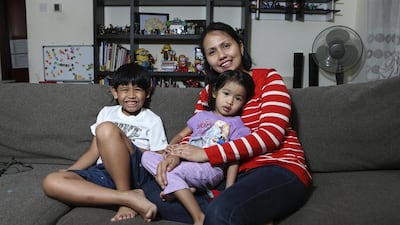 Abigail Caidoy and her children Chloe, 2, and Markus, 7, in their Al Nahda home in Dubai. Sarah Dea / The National
