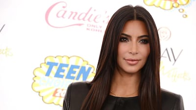 Kim Kardashian's visit to the season-closing race will be a mix of work and play for the notorious socialite. AP