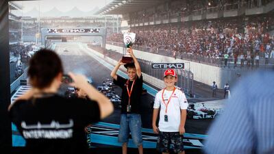 Fans enjoy the Fan Zone at Yas Marina Circuit. Christopher Pike / The National
