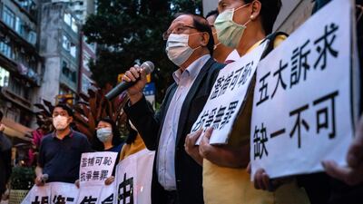 Supporters protest outside Western District police station in Hong Kong after 15 pro-democracy campaigners were arrested. Getty Images