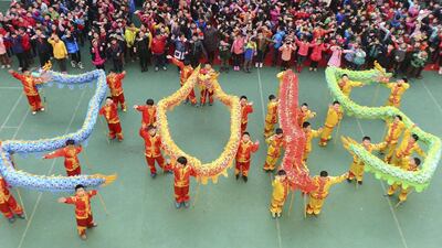 Students with dragon dance props form “2015” to welcome the upcoming New Year at an art school in Hefei, Anhui province in China. Reuters