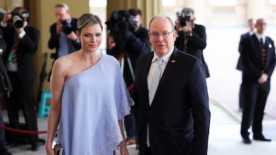 Prince Albert II of Monaco and his wife Charlene, Princess of Monaco, arrive at the reception. Reuters