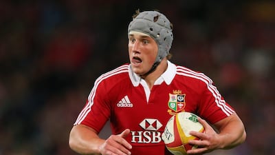 Davies runs the ball during the match. Cameron Spencer / Getty Images