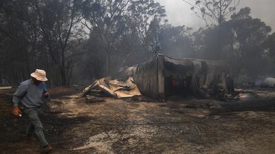 A shed is seen destroyed by fire at a property in Kulnura, Australia. EPA