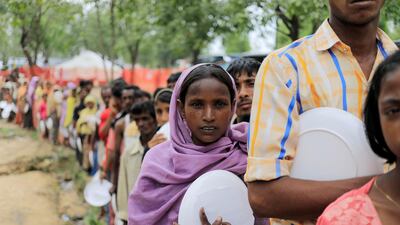 Rohingya refugees line up to get food near the Balukhali refugees camp, close to Cox's Bazar in Bangladesh, on October 21, 2017. Zohra Bensemra / Reuters