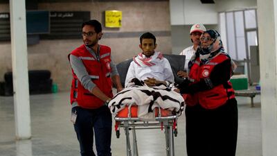 Saudi prisoner Musa al-Awaji lies in a stretcher as members of the International Committee of the Red Cross prepare him to board a plane at Sanaa airport following his release by Yemen's Houthi rebels. AFP