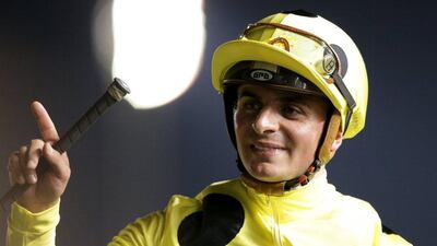 Andrea Atzeni rides Postponed from UAE as he celebrates the winning of the eighth race. REUTERS/Ashraf Mohammad