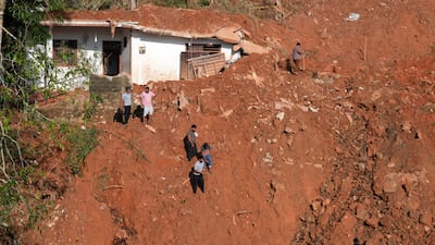 People scour the site of a landslide for survivors after heavy rainfall following Cyclone Ditwah in Kandy, Sri Lanka. Reuters
