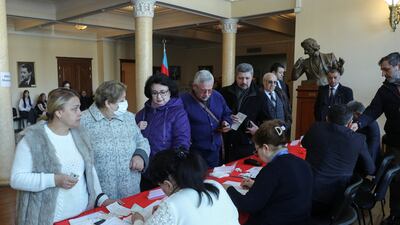 Voters queue up for their ballot papers at a polling station in Baku. Reuters