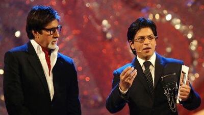 Amitabh Bachchan, left, and Shah Rukh Khan have been invited to Chennai to in September celebrate 100 years of Indian cinema. AFP