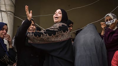 Women mourn at the funeral of Palestinians killed overnight in an Israeli strike on Al Shati refugee camp in Gaza city. AFP