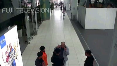This screengrab from CCTV footage obtained by Fuji TV shows Kim Jong-Nam, the North Korean leader's half brother, speaking to airport authorities at Kuala Lumpur International Airport. Fuji TV / AFP