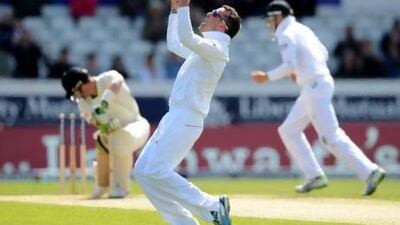 Graeme Swann, right, celebrates taking the wicket of New Zealand batsman Martin Guptill. Philip Brown / Reuters