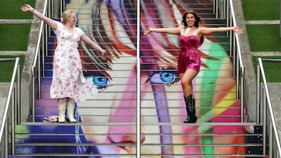 Fans at a mural outside Wembley Stadium. EPA