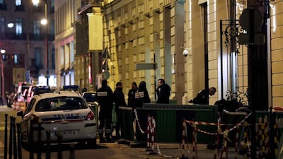 Police strand near the back entrance of the Ritz luxury hotel in Paris on January 10, 2018, after an armed robbery. Thomas Samson / AFP