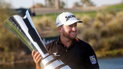 Graeme McDowell celebrates with the trophy after winning the Saudi International on Sunday. AP Photo