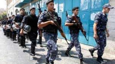 Members of the Palestinian security forces patrol outside the Fatah congress in the West Bank town of Bethlehem yesterday.