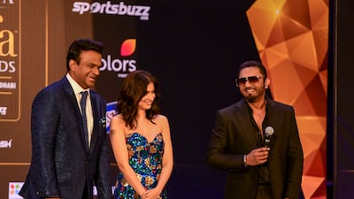 Siddharth Kanan, Indian TV host laughs on stage with Divya Khosla Kumar and Yo Yo Honey Singh.