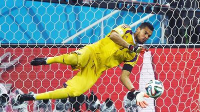 Argentina goalkeeper Sergio Romero makes a save from Netherlands defender Ron Vlaar during a penalty shoot-out in their World Cup semi-final at The Corinthians Arena in Sao Paulo on July 9, 2014. Pedro Ugarte / AFP