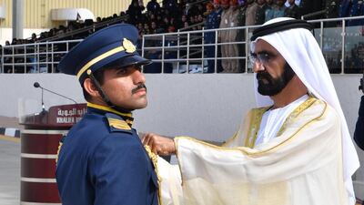 The graduating cadets salutes Sheikh Mohammad before taking their oath. Wam