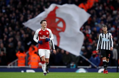 Arsenal's Mesut Ozil celebrates scoring the winning goal against Newcastle. Eddie Keogh / Reuters