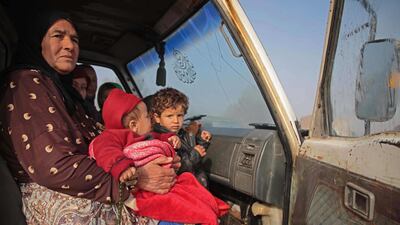 Syrians sit in a vehicle as they drive towards the northern areas of Syria's Idlib province near the Syrian-Turkish border as they flee the bombardments in the southern areas of the country's last major opposition bastion. AFP