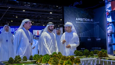 Sheikh Hamdan bin Mohammed, Crown Prince of Dubai, Deputy Prime Minister and Minister of Defence, reviews plans at the Dubai AI Festival on Monday. Wam