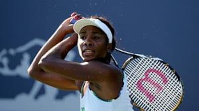 Venus Williams returns a shot against China's Li Na