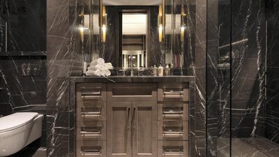 Dark marble finishings in a bathroom. Courtesy Luxhabitat Sotheby's International Realty