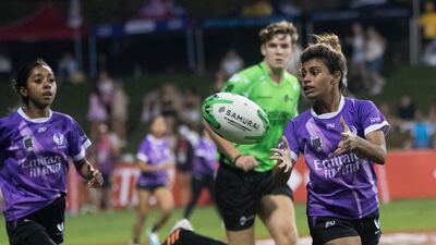 An Al Maha player makes a pass.