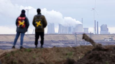 Protesters watch a power plant, on January 14, 2022 near Keyenberg, Germany. Getty