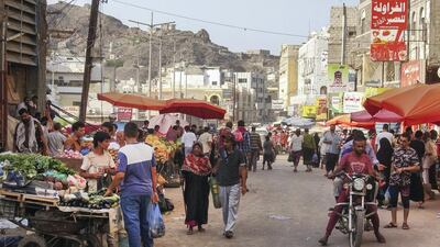 Yemenis shop at a street market in the Crater district of Yemen's southern coastal city of Aden. File photo / AFP