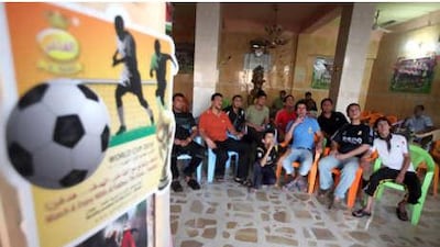 Iraq is a nation of football fans, and love for the sport is perhaps the single thing that has united the country throughout decades of war and sanctions. Above, men watch a World Cup match in a cafe in Sadr City.