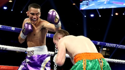 Gabriel Flores Jr. (L) and Matt Conway exchange punches during their junior lightweight bout at MGM Grand Garden Arena in Las Vegas. AFP