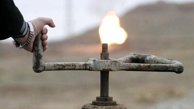 A flame emerges from a pipeline in Baba-Gargur oilfield in Kirkuk, 250 kilometres north of Baghdad. The new cabinet in Iraq has improved the prospect for a deal with the Kurds. Ako Rasheed / Reuters