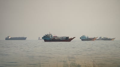 Ships stranded in the Strait of Hormuz, as seen from Musandam, Oman. Reuters