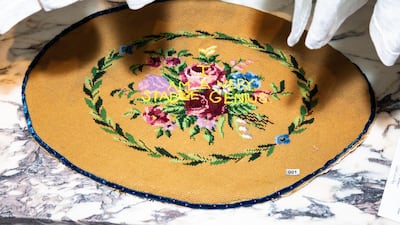 The first work created for the project. Diana Weymar stitched 'I am a very stable genius' onto a needlepoint stool cushion made by her grandmother. Yvonne Tnt / Courtesy Tiny Pricks Project